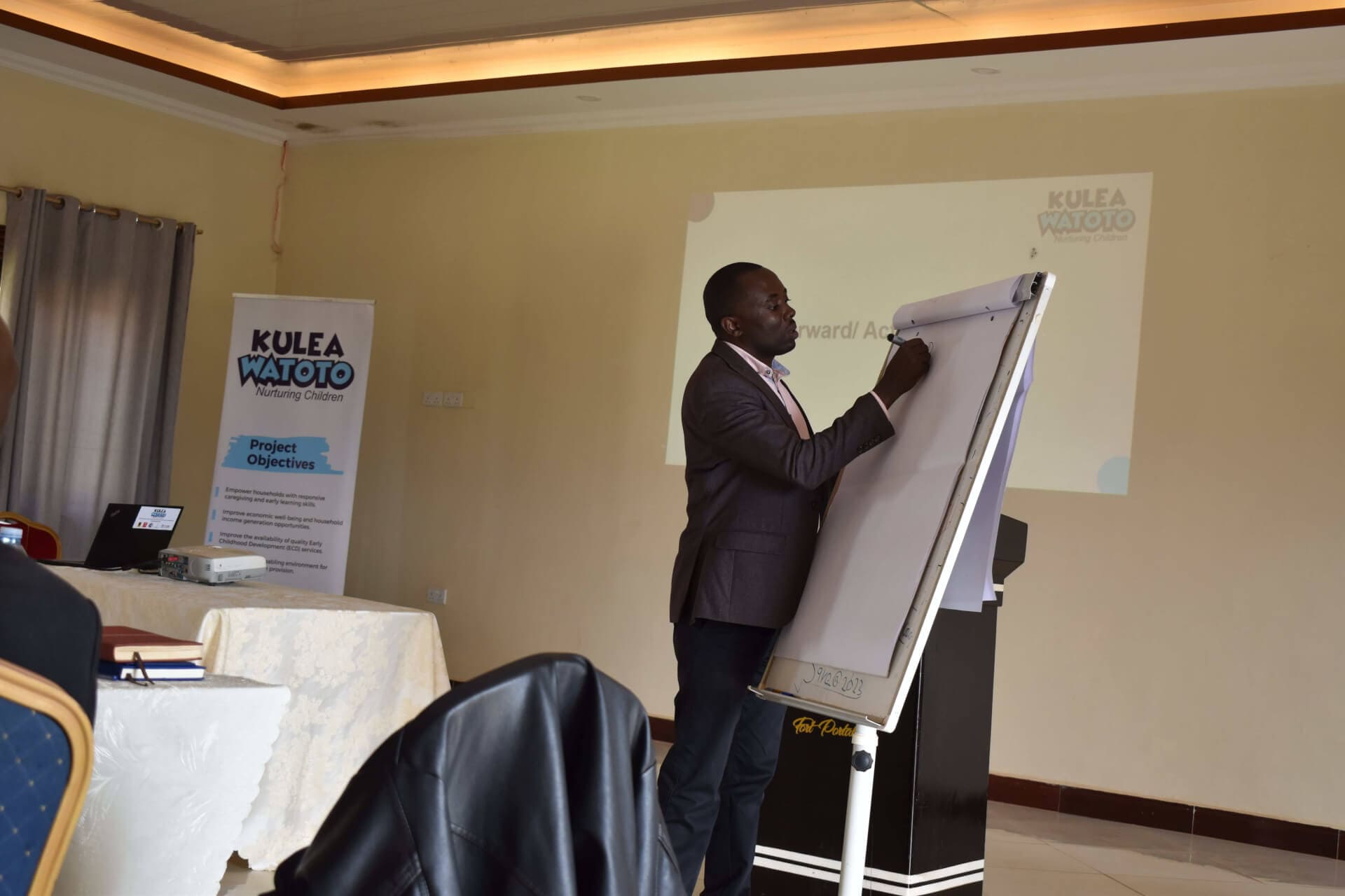 Godfrey Mwesigye the Snior Policy and Advocacy Manager for Kulea Watoto facilitating session on ECD policy issues during the engagement with the Kyegegwa District leaders