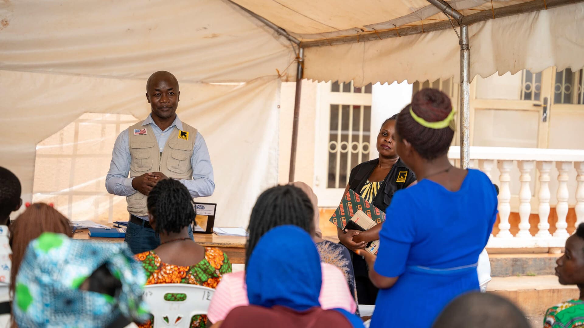 IRC Country Director interacts with a client enrolled under the Kulea Watoto project during a recently conducted field visit in Makindye Division, Kampala.