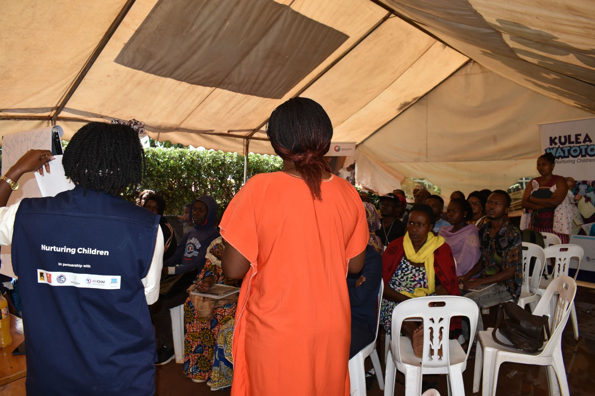 Kulea Watoto Project staff engages clients enrolled under the project on safe funds transfer during a group dialogue conducted at the Learning Resource Center in Makindye.