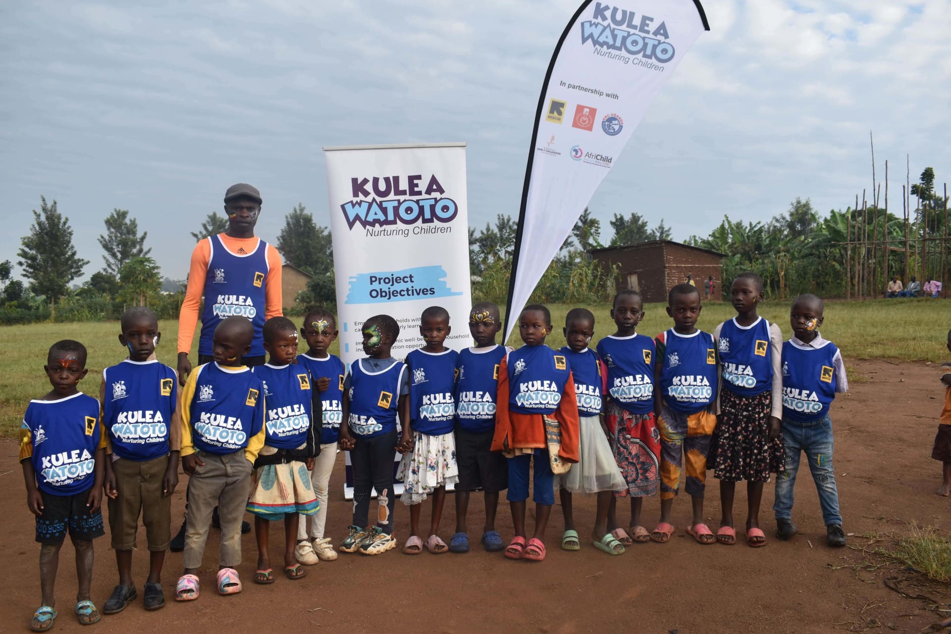 Kulea Watoto project staff with children during the Day of the African Child celebrations in Kyaka II Refugee Settlement