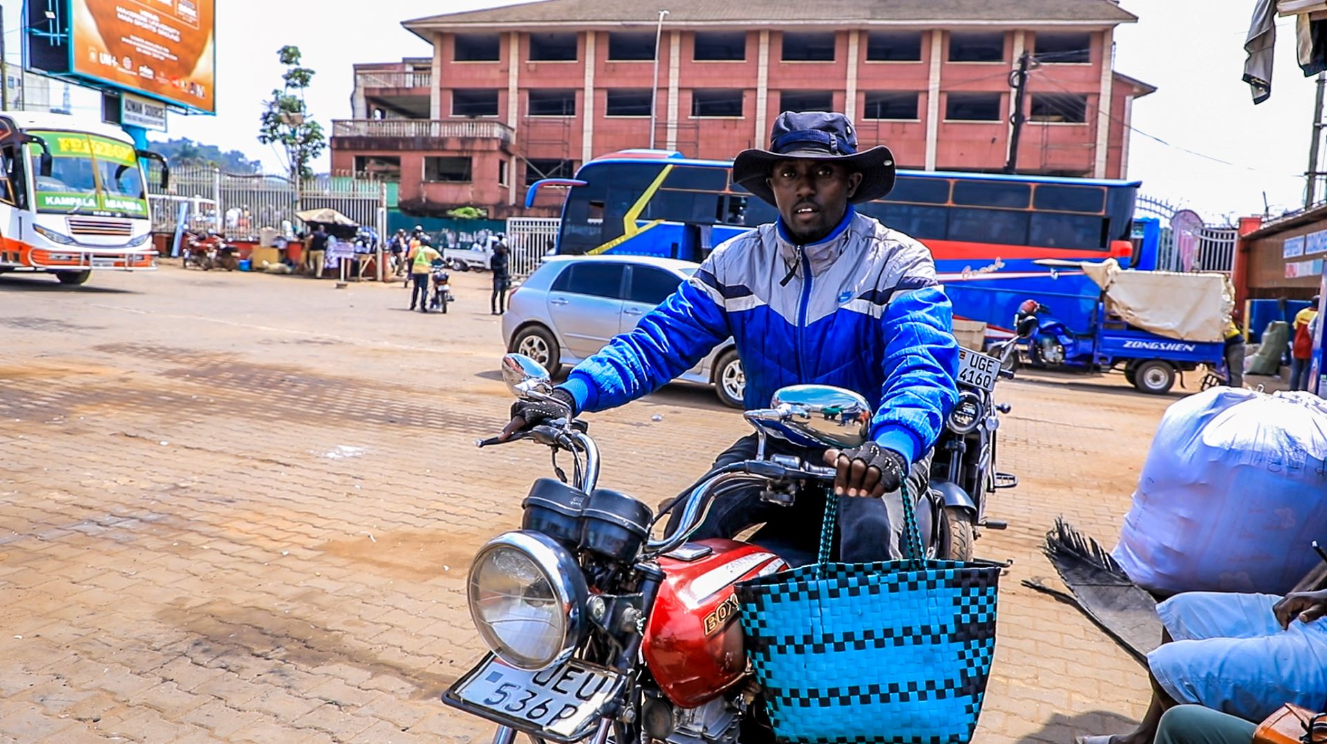 Fauste Ndujumbire, Estella Munezero’s husband prepares to deliver food to customers using his boda-boda. Fauste is working hand-in-hand with his wife to increase on their earnings to be able to provide for their children’s needs