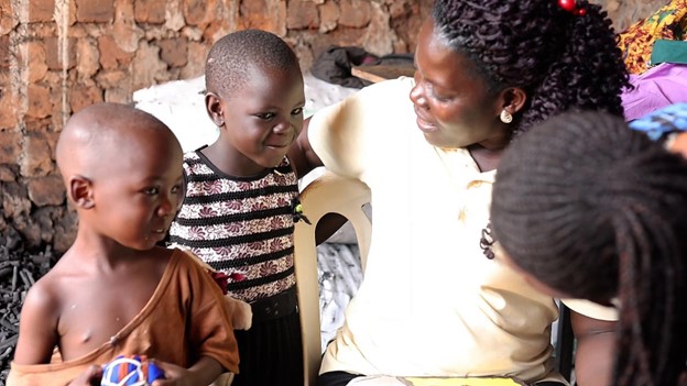 Margaret Nakavuma Kisakye, a trained Village Health Team (VHT) member, interacts with the children during her routine visit to homes in Nsambya, Makindye division