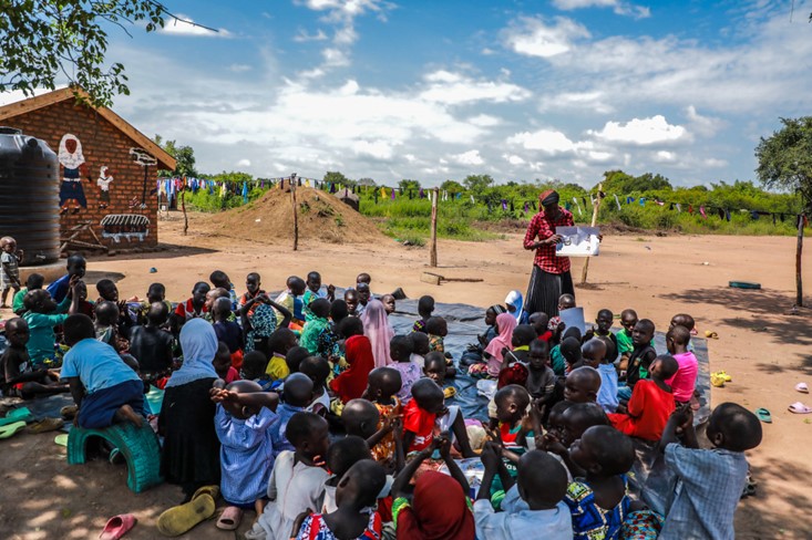 Rukia Mata crafts a ball out of fabric scraps at Mungufeni Home Learning Center. She is grateful for the support in starting up the learning center as it has given chance to their children to have early education essential for a good start in future learning