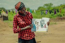 Rukia Mata crafts a ball out of fabric scraps at Mungufeni Home Learning Center. She is grateful for the support in starting up the learning center as it has given chance to their children to have early education essential for a good start in future learning